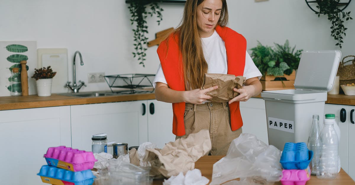 Where on Earth is this manor-house-looking structure? - Young woman sorting trash for recycling