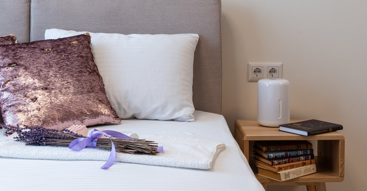 Where to book Henn-na Hotel Maihama - Lavender bouquet placed on bed in cozy bedroom in sunny morning