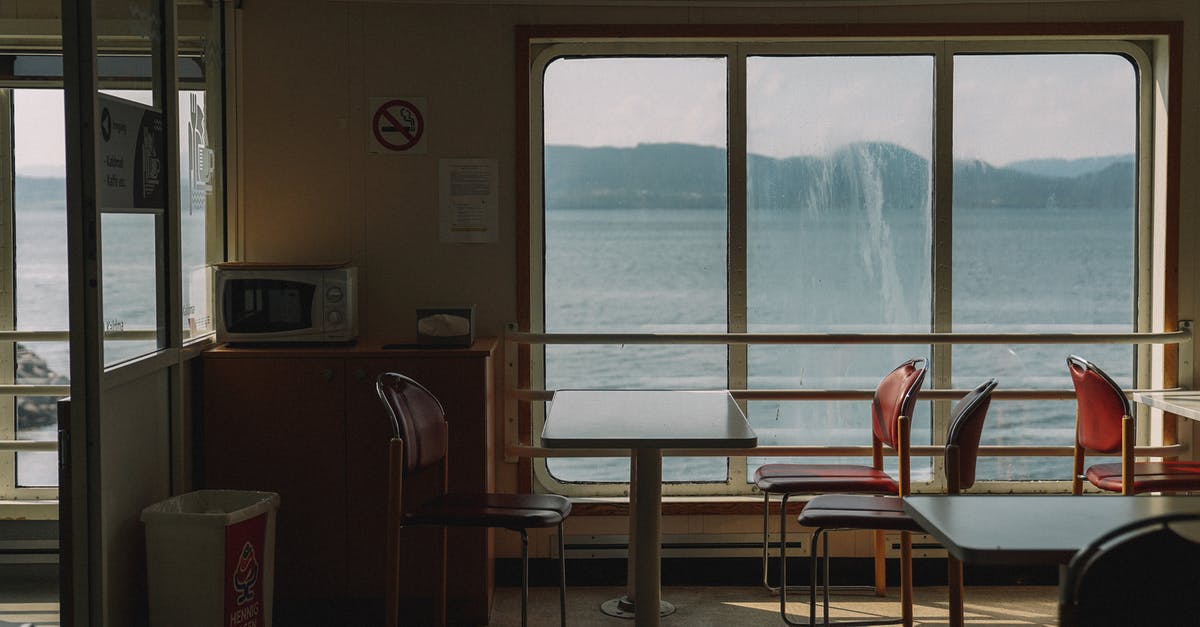 Where to find ferry flights and empty leg flights? - An Empty Table with Chairs in the Ship