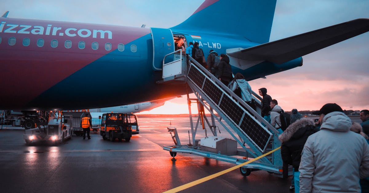 Where to get connecting flight boarding pass? [closed] - Photo of People Boarding Airliner