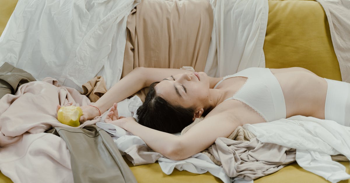 Where to sleep in the Salar of Uyuni? - Woman in White Tank Top Lying on Bed