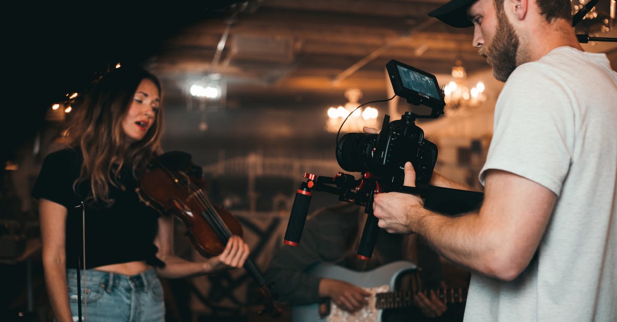 Where was this music video with a dramatically lit bridge filmed? - Man Taking a Video of a Woman Carrying a Violin