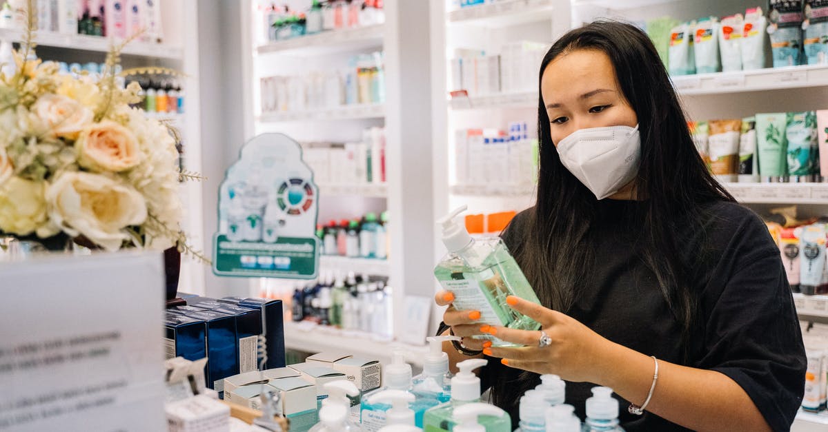 Where was this stock photo taken? - Woman in Black Shirt Holding A Hand Sanitizer Bottle