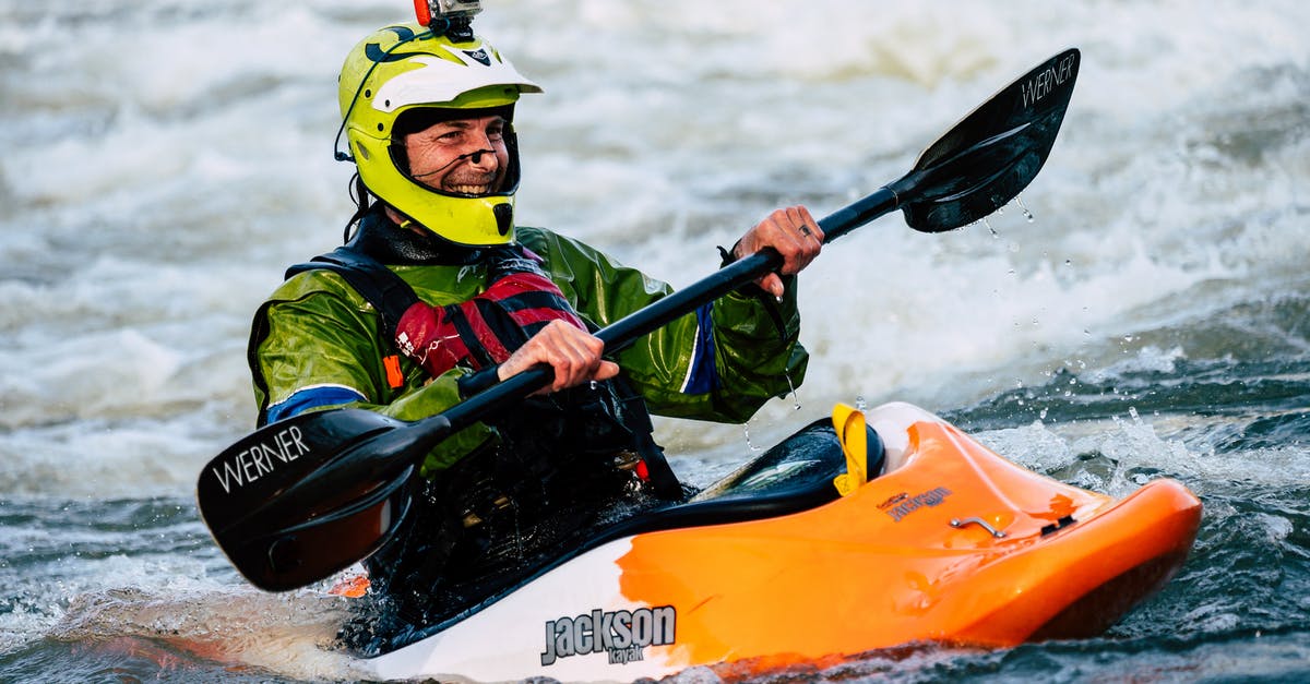 Which airlines are willing to take whitewater kayaks in luggage? - Photo of Smiling Man Whitewater Kayaking