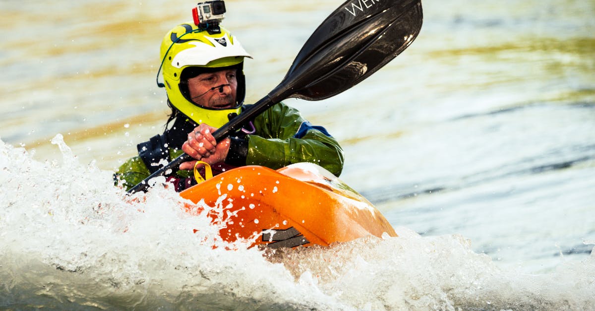 Which airlines are willing to take whitewater kayaks in luggage? - Photo of Man Whitewater Kayaking