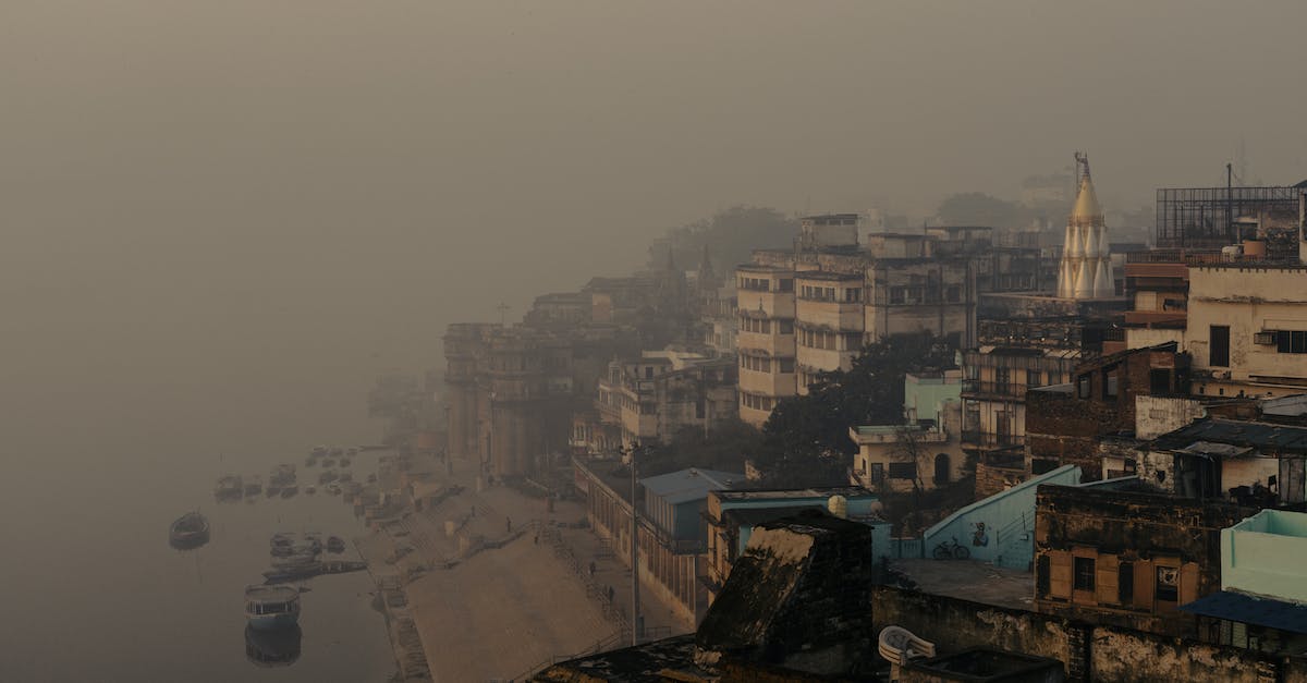 Which are the cleanest ghats in Varanasi? - Aerial Photography of Buildings Beside Ganges River in Varanasi, India