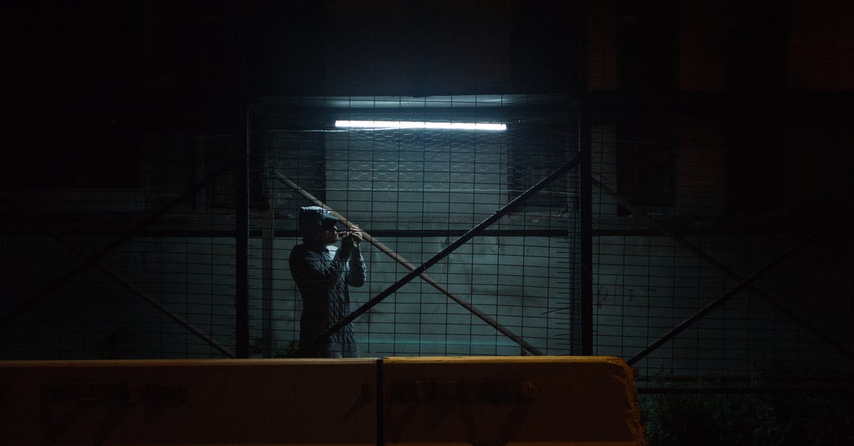 Which building is this? And where is it located? [closed] - Unrecognizable man standing near parking lot