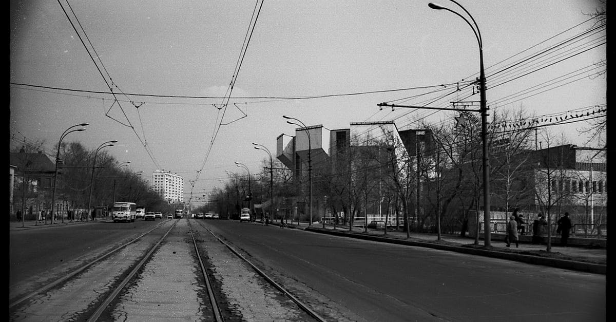 Which city is shown in the film "A trip to Wiesbaden"? - Vehicles riding on city road near tram rails