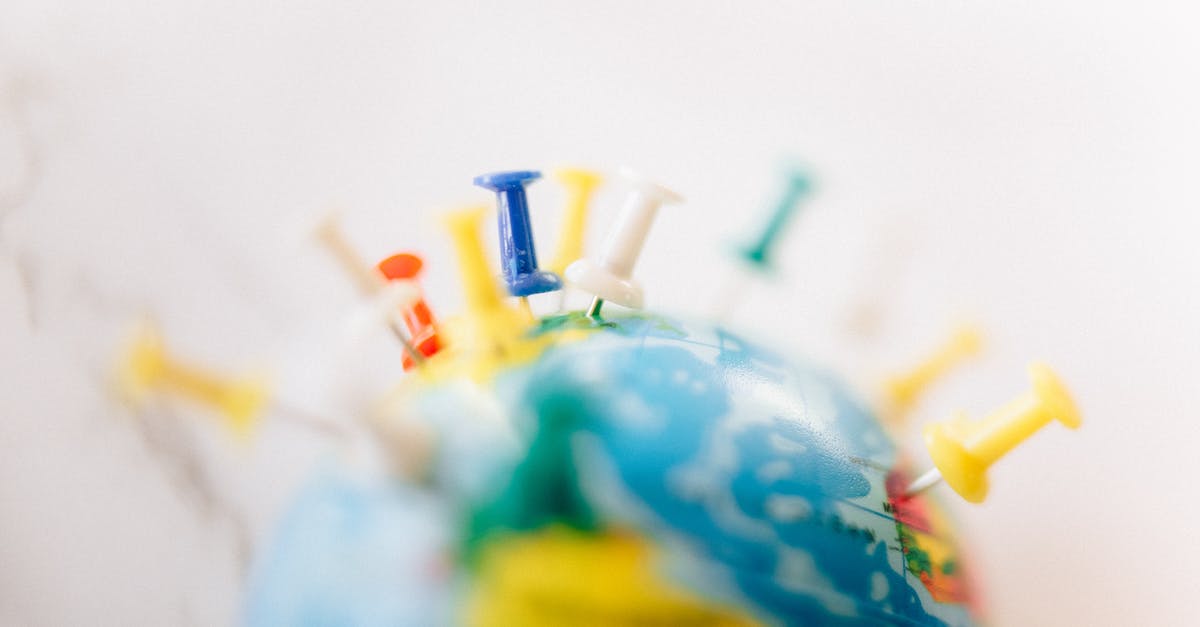 Which countries refer to themselves by their shape? [closed] - A Globe with Push Pins