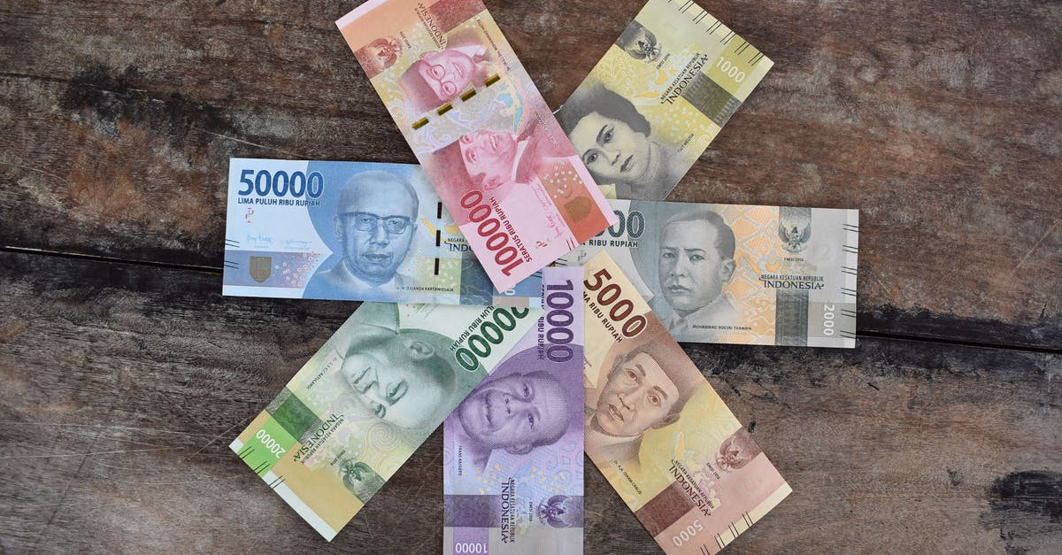 Which denomination banknotes should I take to Philippines? - Banknotes on the Wooden Surface