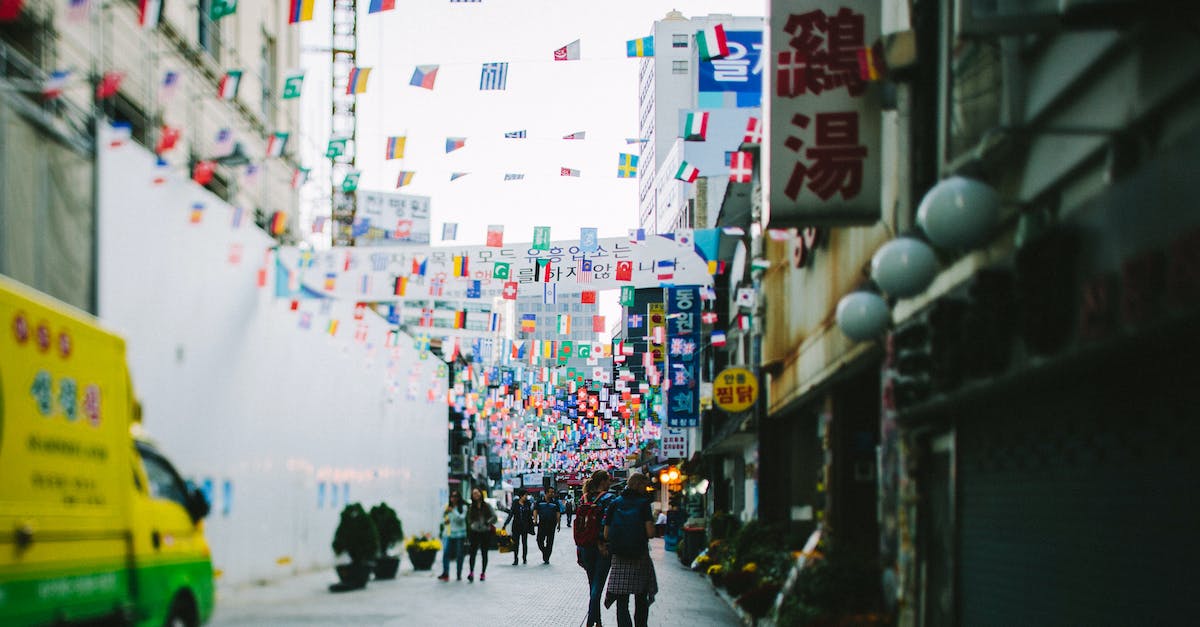 Which is the cheapest ferry to Jeju in South Korea? - People Walking on Street