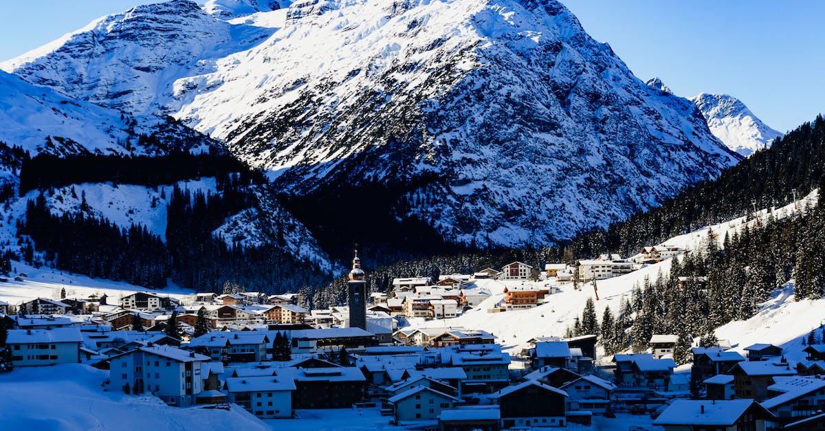 Which is the cheapest ski resort in the Alps? [closed] - Village Near Snow Covered Mountain