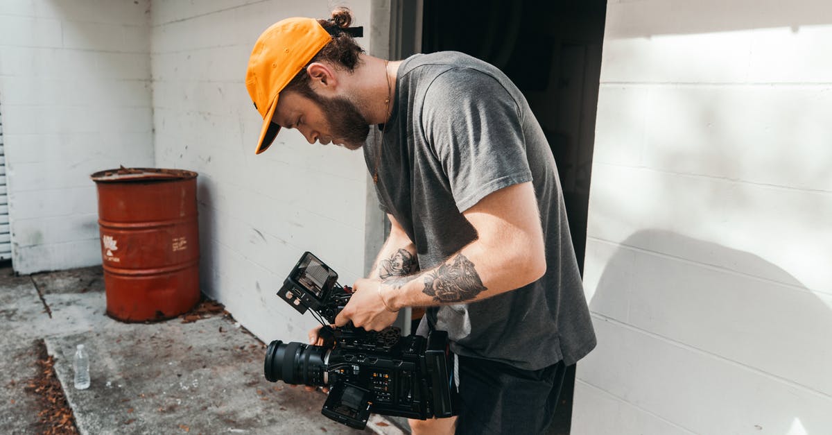 Which place was this video shot in? - Man in Grey Crew Neck T-shirt and Yellow Hat Holding Black Dslr Camera