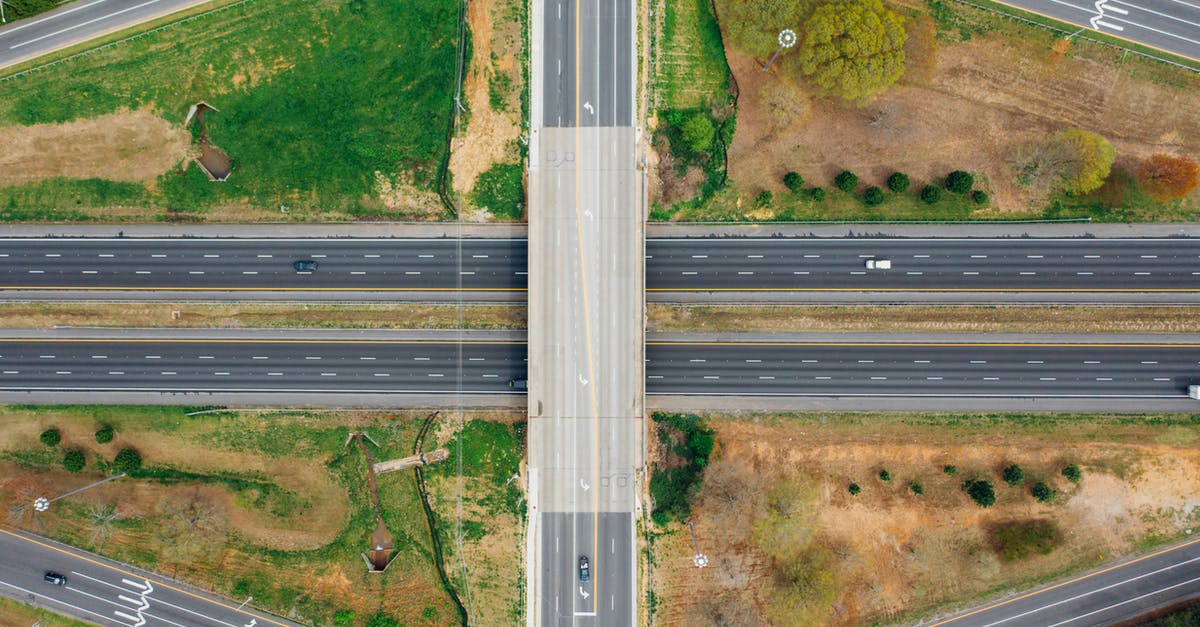 Which route to take driving from Seattle to Boston? - Road connection near green trees in suburb