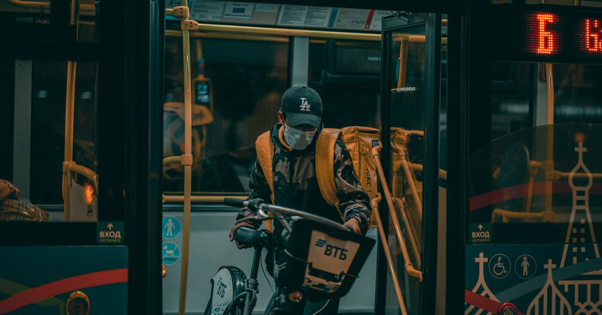 Which train stations in Brussels have bicycle access? - A Man Going Outside the Train with his Bicycle