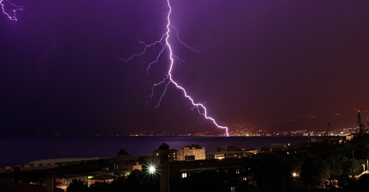 Which Turkish town has the best climate all year round? - Thunderbolt flashing in purple night sky over coastal town