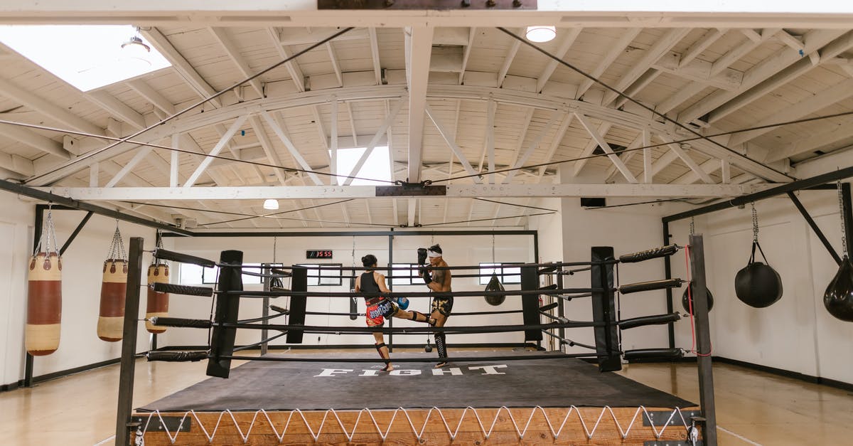 Which UK Visa for attending a short training course? - A Man and a Woman Sparring Inside the Boxing Ring