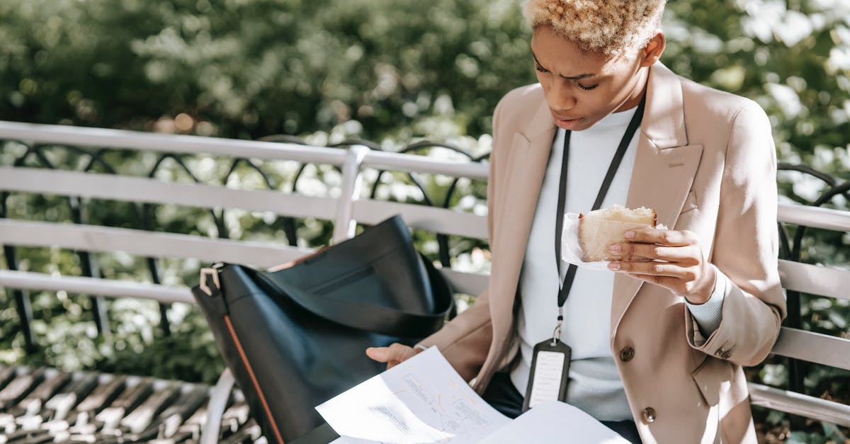 Which visa is applicable to me? Visitor or Short Student Study Visa - Serious woman looking through documents Which visa is applicable to me? Visitor or Short Student Study Visa - Serious woman looking through documents