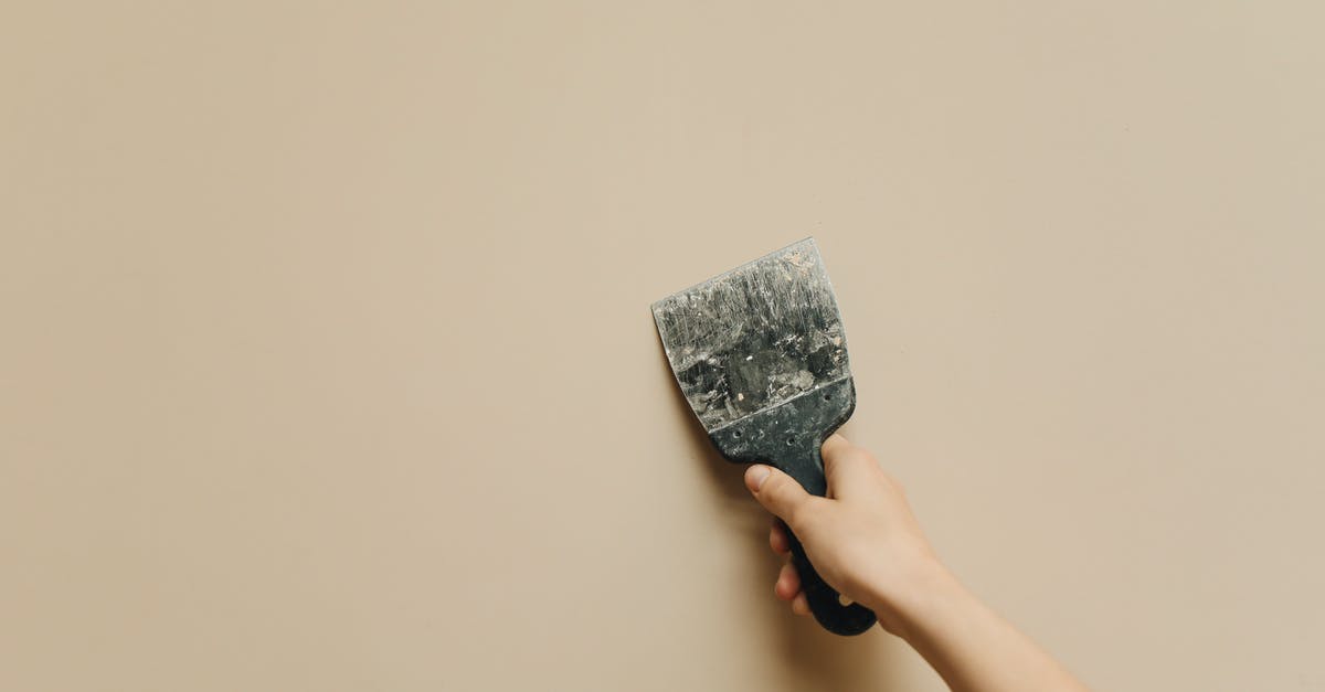 Which wall is this? [duplicate] - Person Holding Gray and Black Textile