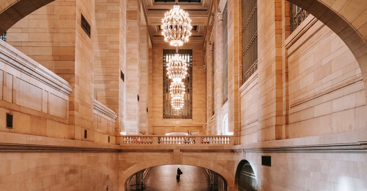 Who enforces passport requirements for passengers departing the US by air? - Interior of arched passage in railway terminal with chandeliers Who enforces passport requirements for passengers departing the US by air? - Interior of arched passage in railway terminal with chandeliers