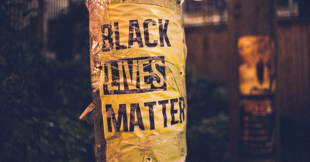 Who is responsible for the refund policy on a code-share flight? - Inscription of protest movement saying black lives matter on pole in city street in evening