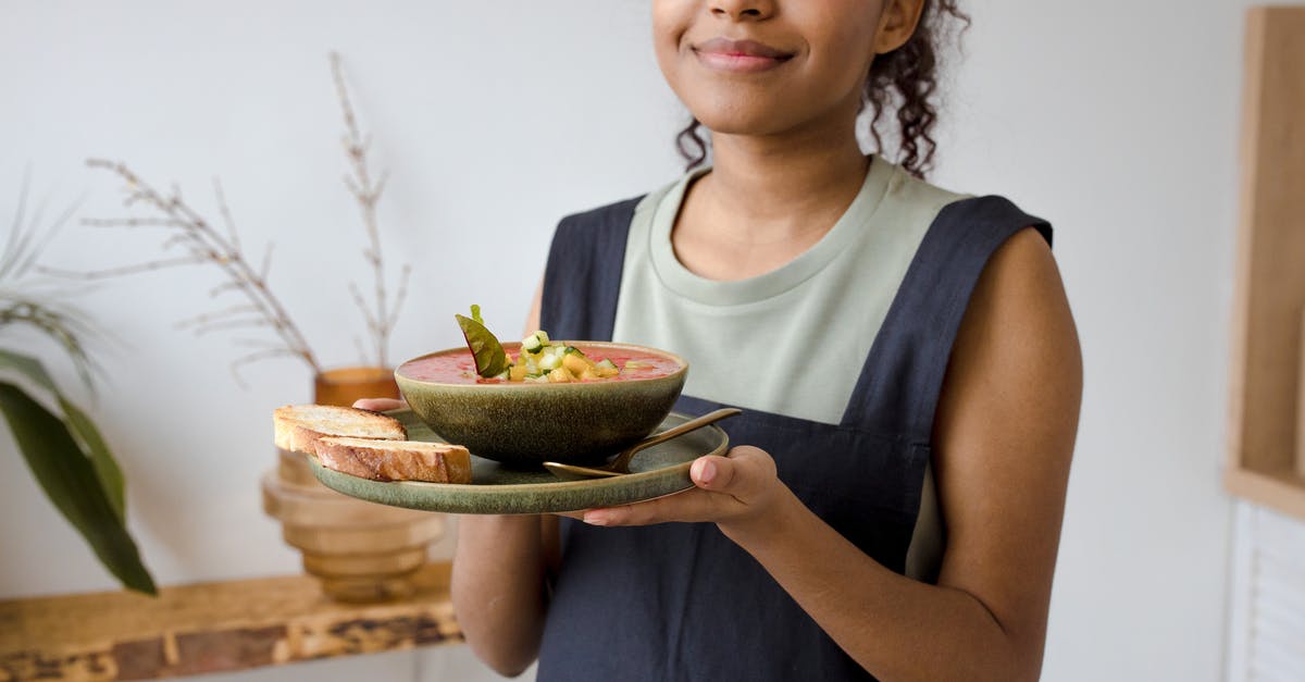 Whose responsibility is update to meal preference? - Woman in Blue Tank Top Holding Sliced Watermelon