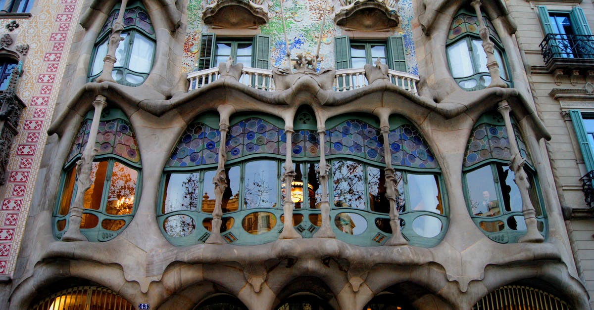 Why are CaixaBank ATMs in Barcelona so complex? - Blue and Brown Concrete Building