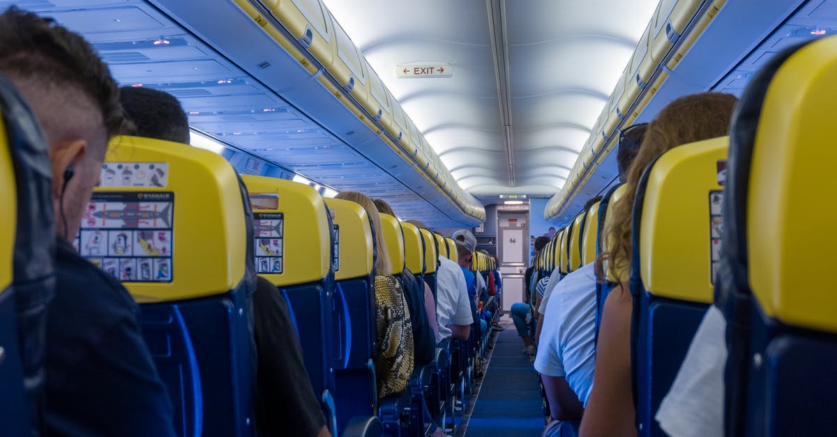 Why are some airplane seats numbered "DEK"? - Passengers Seated on the Plane