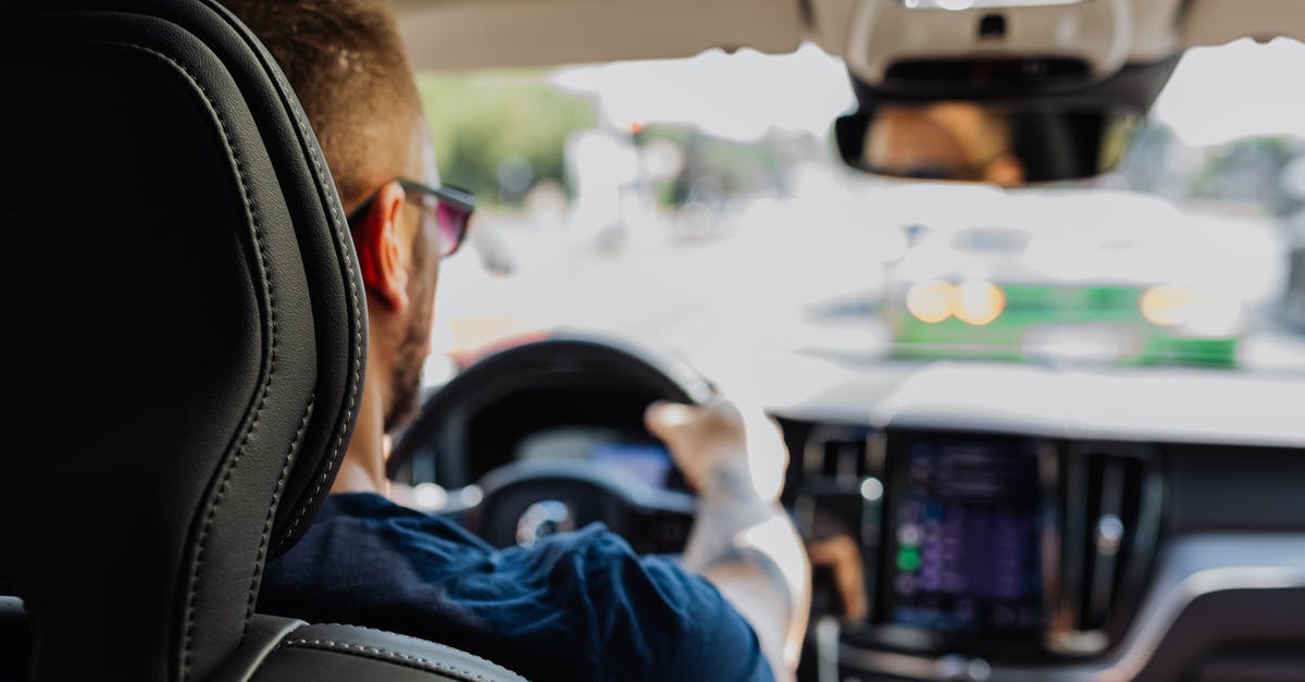 Why are there not more auto piloted trains? [closed] - Man in Blue Long Sleeve Shirt Driving Car