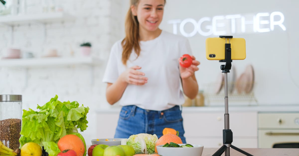 Why aren't conventional mercury thermometers allowed onboard? - Woman in Kitchen with Vegetables and Smartphones