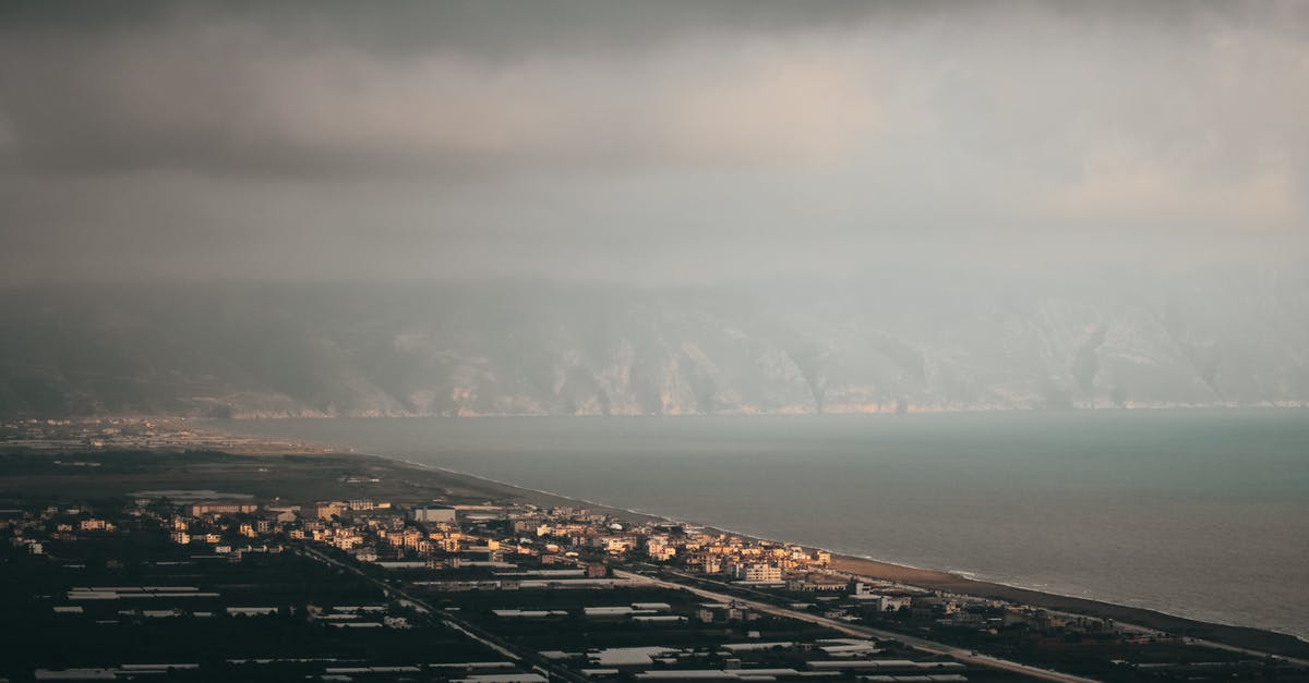 Why aren't there any big buildings on coastal regions [closed] - Aerial View of City Near Body of Water