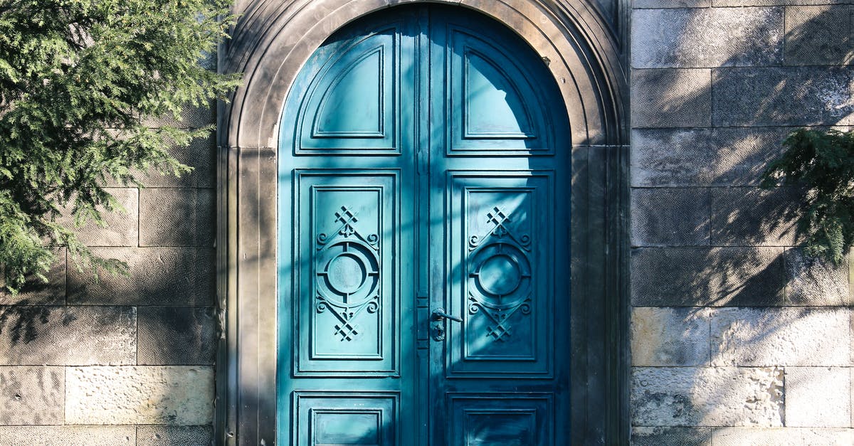 Why did a gate officer and exit immigration officer try to peel my visa sticker? - Closed Blue Wooden Door Why did a gate officer and exit immigration officer try to peel my visa sticker? - Closed Blue Wooden Door