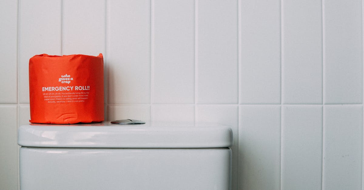 Why did this particular Czech toilet have no paper? [closed] - Red Toilet Paper on White Ceramic Toilet