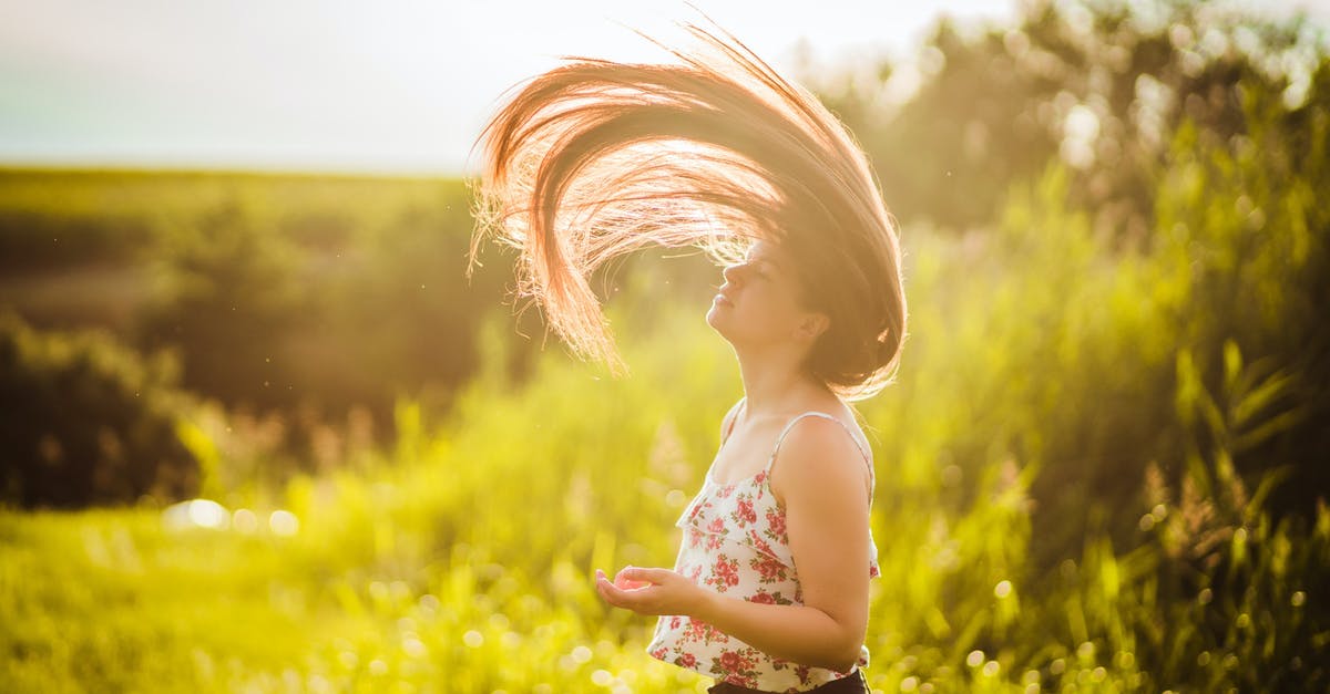 Why do Eurotunnel do cheaper fares for shorter trips - Close-Up Shot of a Woman Doing Hair Flip during Sunset