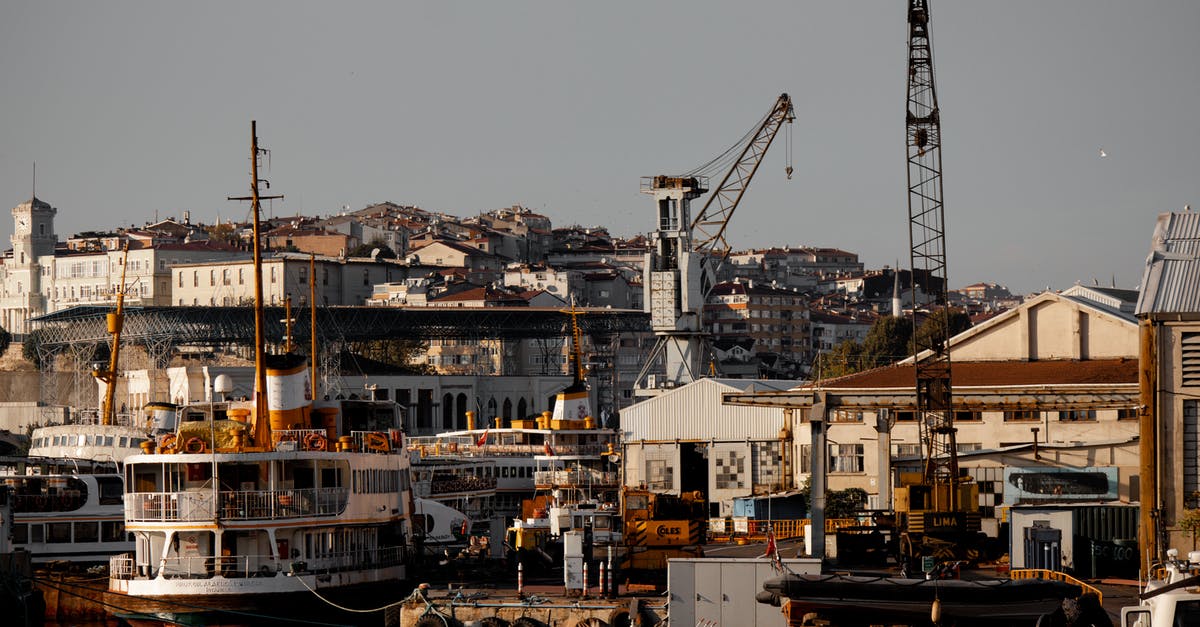 Why do ferries have a trucker's lounge? - Harbour with Ferries and Cranes and Town in Background