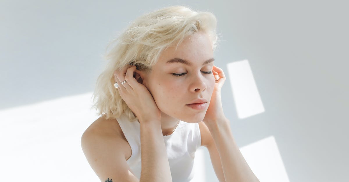 Why do I feel pressure in the ears in a plane? - Woman in White Tank Top With Silver Bracelet