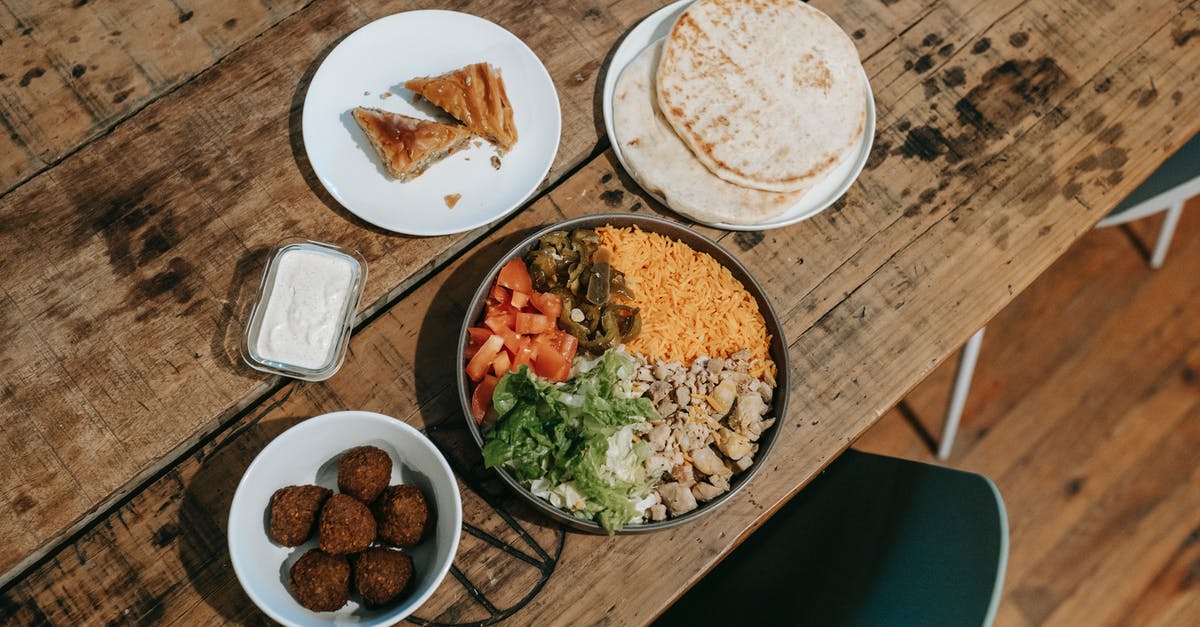 Why do Indian restaurants in India serve food items in every plate, while those in the U.S. simply put it out on the table? - Various traditional Indian dishes served on table in restaurant Why do Indian restaurants in India serve food items in every plate, while those in the U.S. simply put it out on the table? - Various traditional Indian dishes served on table in restaurant