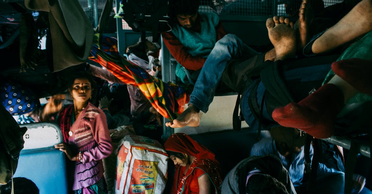 Why do people crowd baggage carousels? [closed] - Bus full of people and luggage