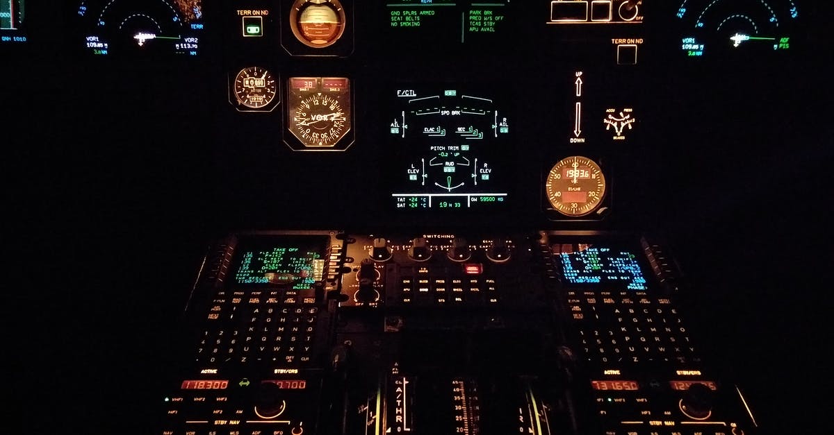 Why do some planes have flashing lights within the plane cabin? - Black Multicolored Control Panel Lot