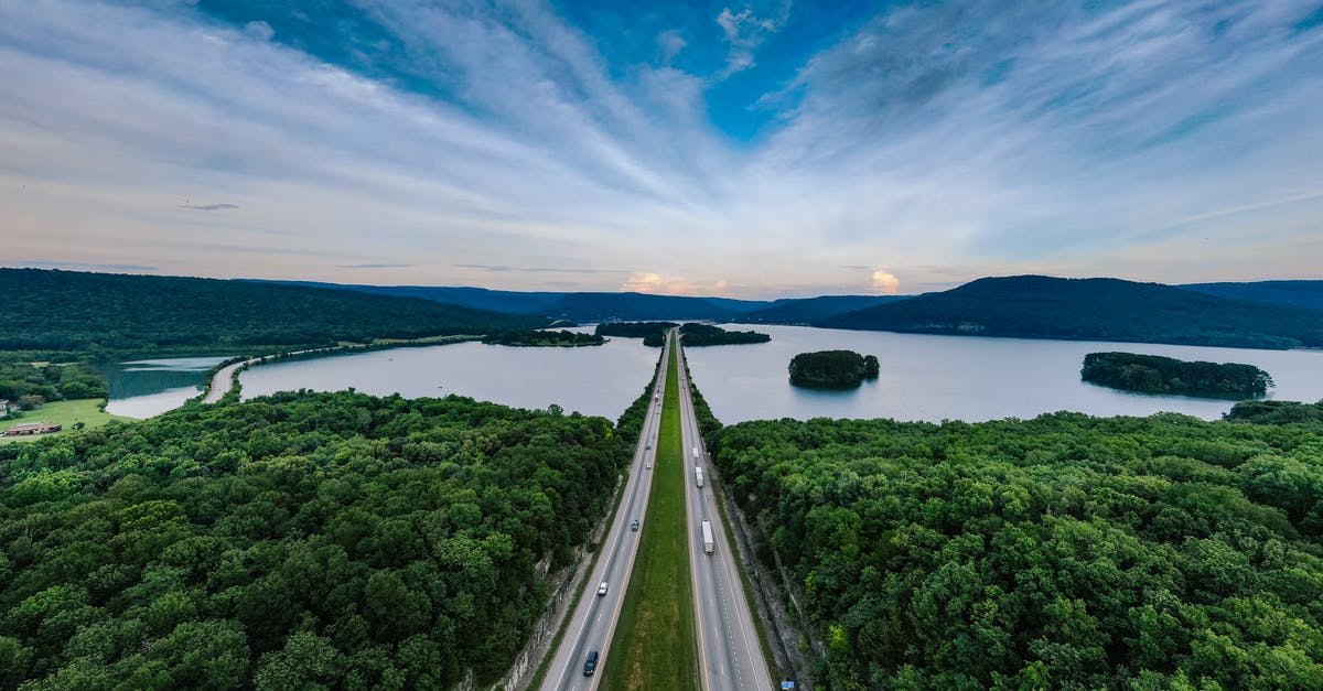 Why do trucks pass each other on the highway? - Road Between Trees