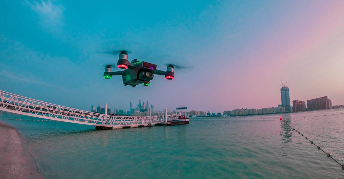 Why does a flight from Melbourne to Cape Town need to go via Doha? - Modern drone filming video while flying above city river Why does a flight from Melbourne to Cape Town need to go via Doha? - Modern drone filming video while flying above city river
