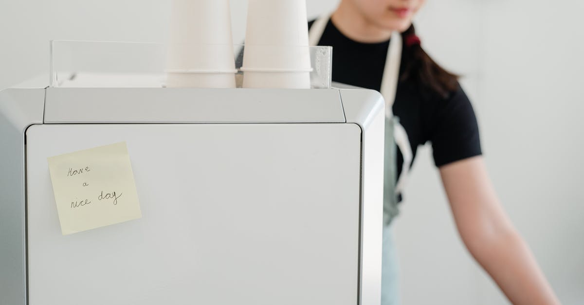 Why does each consul general have a specific service area? - Crop woman in apron near coffee machine