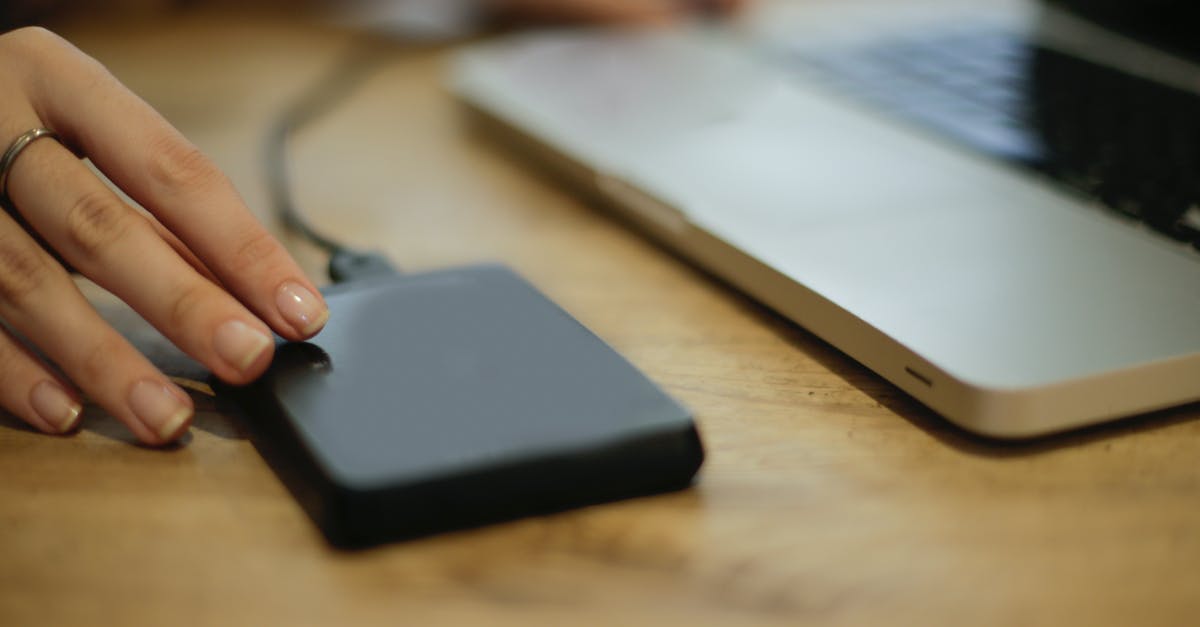 Why does my laptop charger not work with this adapter? - Black Square Device on Brown Wooden Table