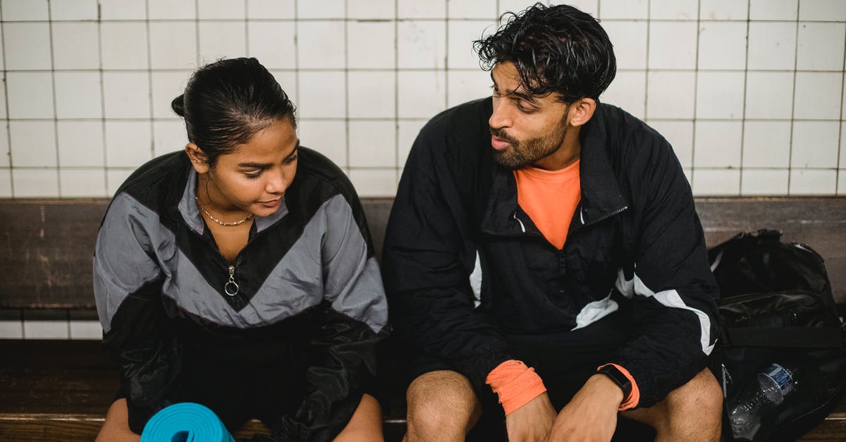 Why does Virgin Trains need two addresses? - Two Young Sport People Resting after Fitness Exercises in Changing Room