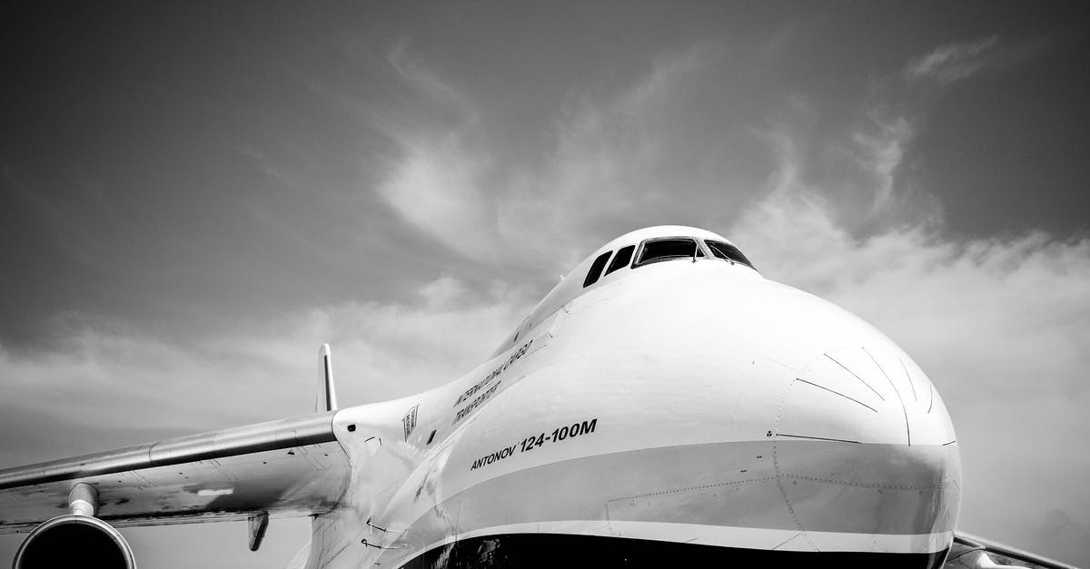 Why don't airlines install Faraday cages in their planes? [closed] - Grayscale Close-up Photo of Front of Airplane