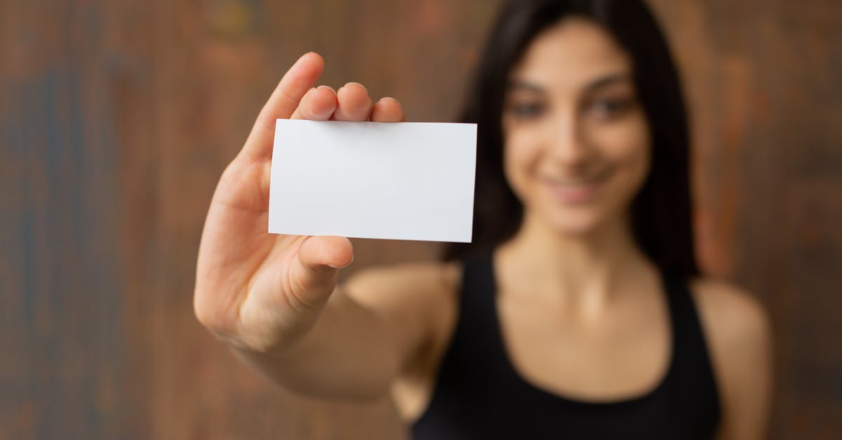 Why don't more flights offer under-carriage cameras? - Smiling ethnic woman with mock up business card