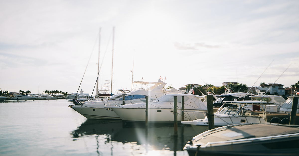 Why frequent inflight directions to Sachs Harbour and Eureka? - White Yacht on Body of Water