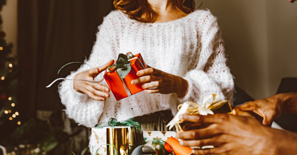 Why is sex/gender present in EU-issued passports? - Woman in White Knit Sweater Holding Red and White Ceramic Mug