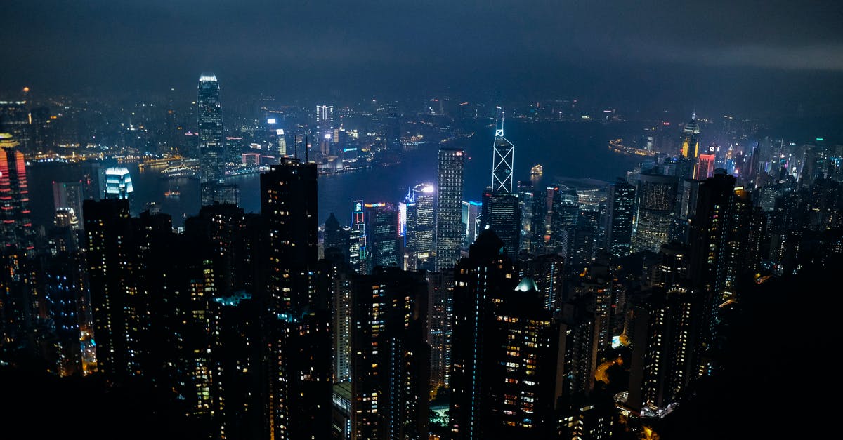 Why were water bottles confiscated in a boarding gate jetway in Hong Kong? - Aerial View of City Buildings