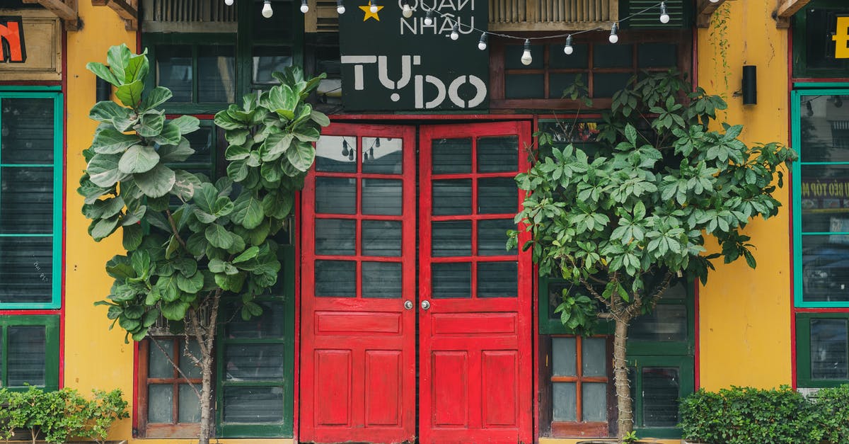 Why would a restaurant called "London Restaurant" in Hong Kong have nothing to do with London or anything British? [closed] - A  Restaurant with Red Double Doors at the Entrance